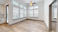 Located in Longwood, Florida, this thoughtfully designed 2-bedroom, 3-bathroom residence offers a clean, modern aesthetic across a single floor. Light wood-look flooring flows through the main living areas, anchored by crisp white walls and recessed lighting that create a bright, welcoming atmosphere.

The kitchen stands out as a central highlight, featuring granite countertops, a large center island with pendant lighting, white shaker-style cabinetry, stainless steel appliances, and a undermount sink positioned beside a window. The open layout connects seamlessly to the living room, making it ideal for entertaining.

Both bedrooms are generously proportioned, with the primary bedroom offering plush carpet flooring, dual windows that invite natural light, and access to a well-appointed closet with built-in wire shelving. The second bedroom also features light-filled windows and wood-look flooring.

The three bathrooms are finished with granite-topped white vanities, framed mirrors, gold-tone hardware, and tiled tub-shower combinations. Two dedicated closets provide ample storage. A private balcony extends the living space outdoors, rounding out this well-appointed residence in a comfortable Longwood community.