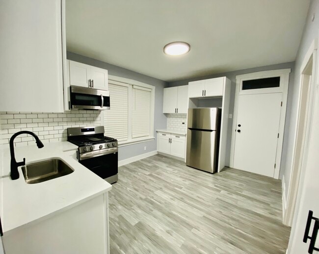 Kitchen with back door view - 2601 W 23rd St