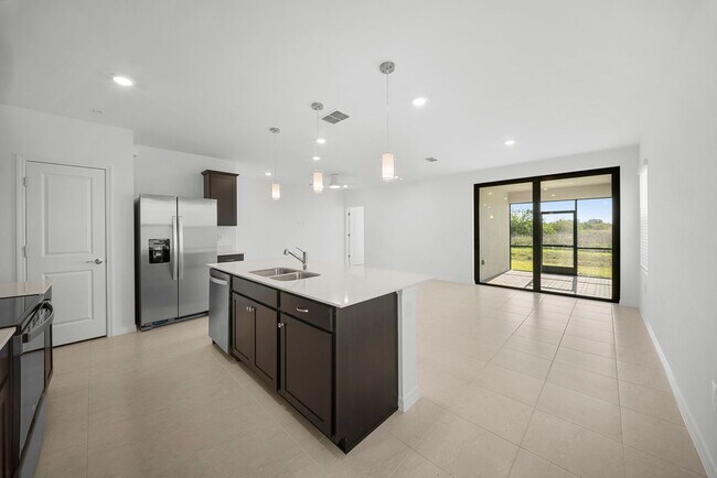 Foto del edificio - Newly constructed property offers four spacious bedrooms, two full bath in Lehigh Acres