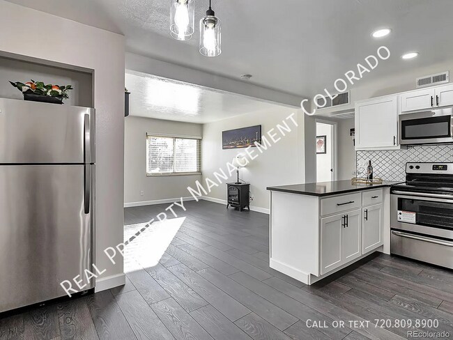 Building Photo - 3613 S Sheridan Blvd Unit 12