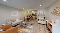 Located in San Dimas, California, this single-story residence offers a well-designed, open-concept layout with a cohesive flow throughout. The living area features light wood-style flooring, recessed lighting, and a sliding glass door that opens to a private patio, filling the space with natural light and providing seamless indoor-outdoor access.

The kitchen is thoughtfully appointed with white shaker cabinetry, granite countertops, a double-basin stainless steel sink, a tile backsplash, and a full suite of stainless steel appliances. A breakfast bar with seating connects the kitchen to the dining area, making it ideal for casual entertaining.

The bedrooms are carpeted for comfort and each includes a ceiling fan, a closet with built-in rod and shelving, and a window for natural light. The bathroom is equipped with granite countertops, white cabinetry, a combined tub and shower, and wood-style flooring.

Throughout the home, neutral tones and consistent finishes create a clean, contemporary ambiance. Ceiling fans are present in multiple rooms for year-round comfort. The overall design balances functionality and modern style, making this a well-appointed single-floor residence in the heart of San Dimas.