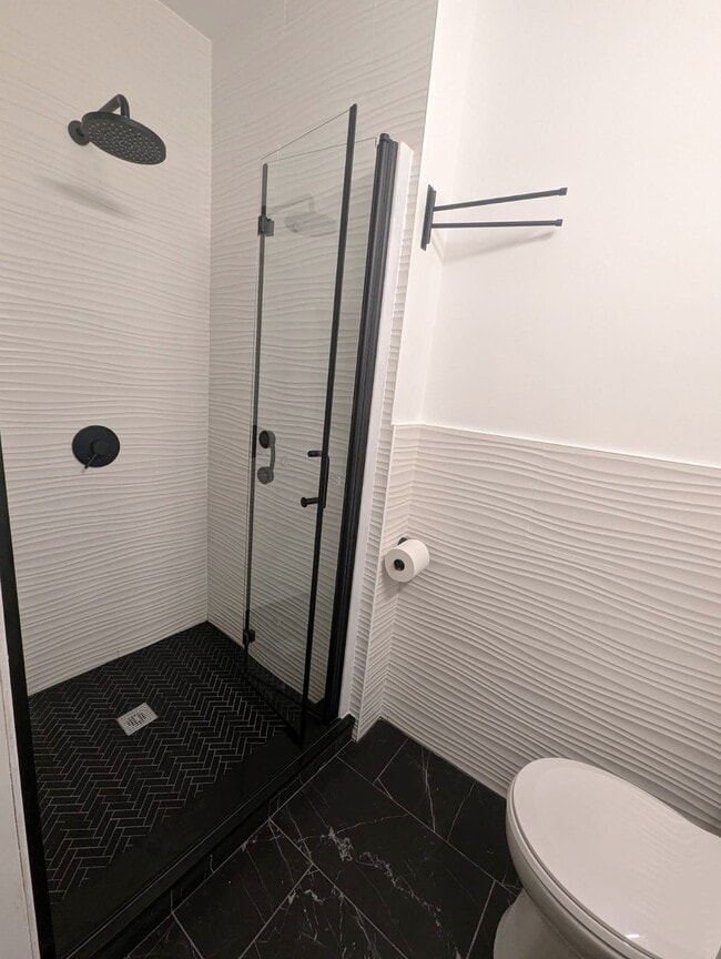 Renovated Bathroom has modern fixtures and a stylish design - 162 27th St