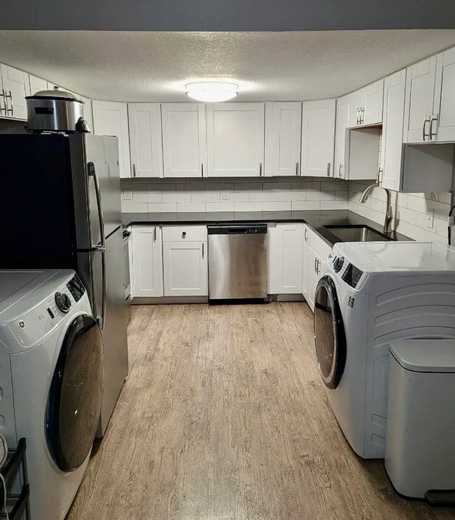 Photo - Beautifully Renovated 3 Bedroom Apartment with Private Balcony, In-Unit Laundry & A/C