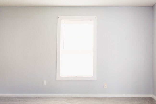 Living room with brand new carpets. - 2902 8th Ave SW