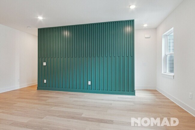 Foto del edificio - Brand New three-story townhome offers a sp...