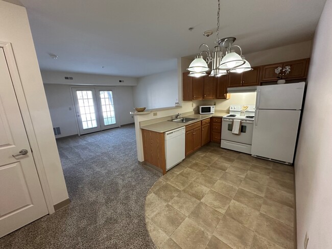 Kitchen with Breakfast Bar - Union Square Senior Apartments