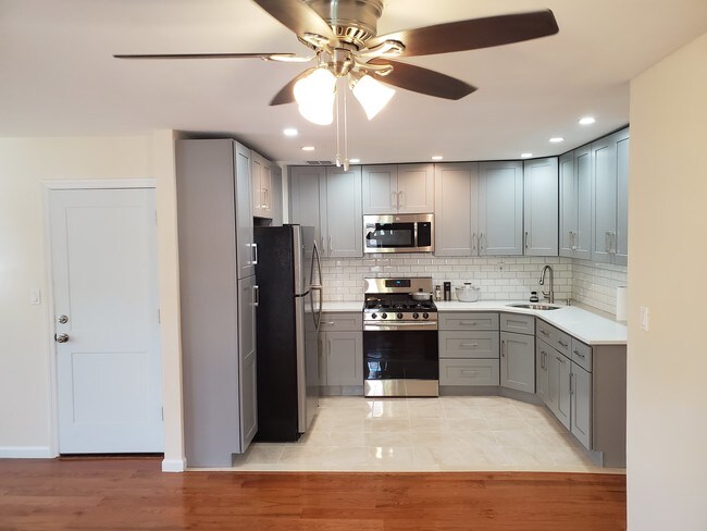 Modern kitchen with lots of cupboards - 216-21 102nd Ave