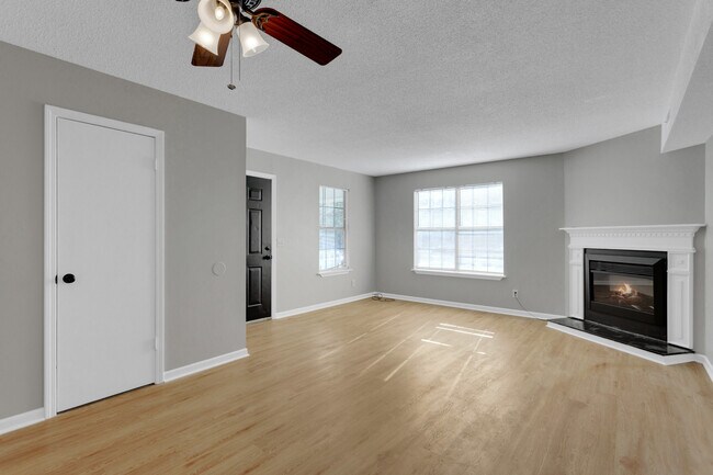 Living Room w/ Fireplace - 101 Montague Dr Townhome