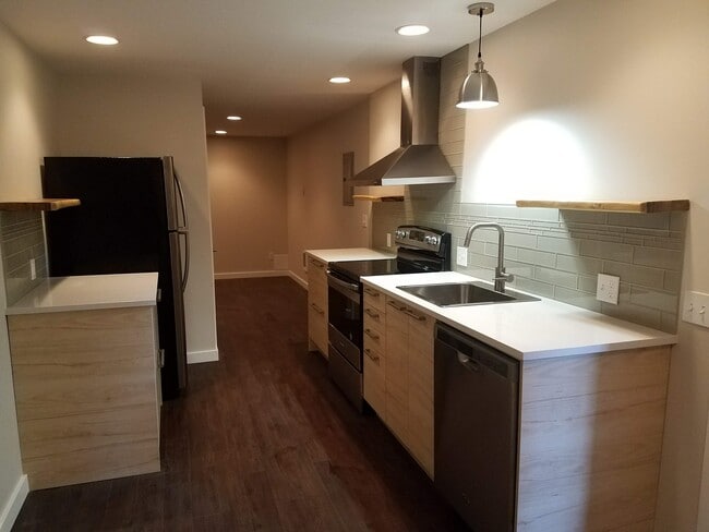 Galley kitchen with stainless steel appliances - 1610 SW Freeman St