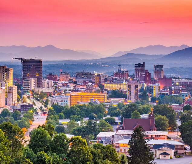 The city skyline and mountains at dusk