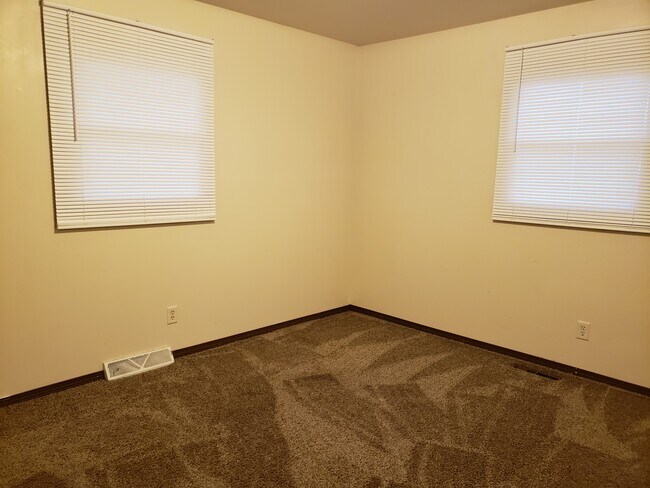 Bedroom 1, carpeted, freshly painted, large double closet, carpeted - 3346 Brown St