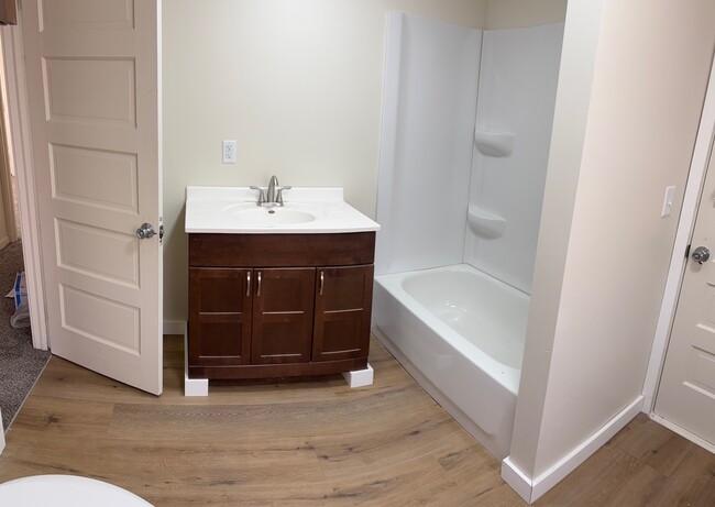 Large, newly renovated bathroom with cherry wood & tub/shower. Mirror will be added. - 144 Coolidge St