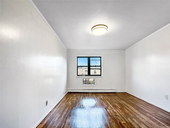 Building Photo - 23-53-53 77th St