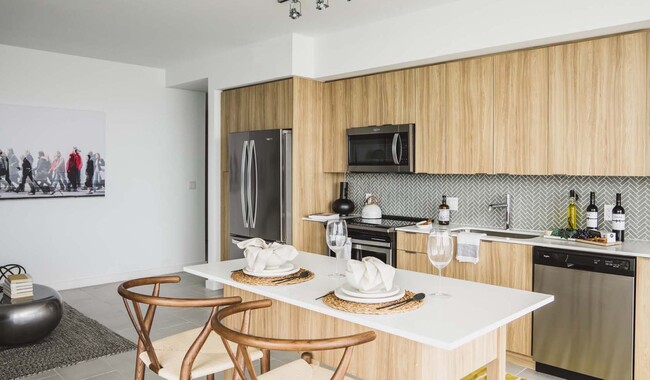 Your new home features a spacious kitchen with brand-new stainless-steel appliances - The Watermarc at Biscayne Bay