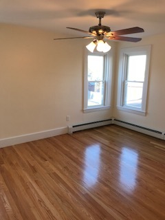 Front bedroom features two closets, one a walk in, as well as new plaster ceiling and hardwoods. - 114 Elm St