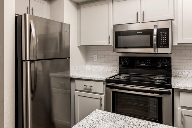 Kitchen with Built-In Microwave and Stainless Steel Appliances - Diamond Interior - The Morrison
