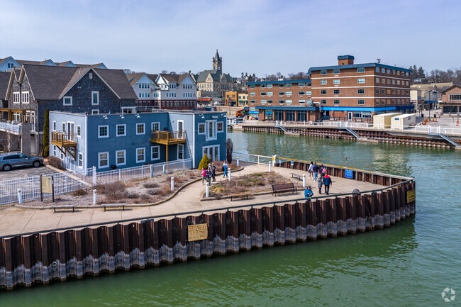 People Enjoying a Walk Through the Marina