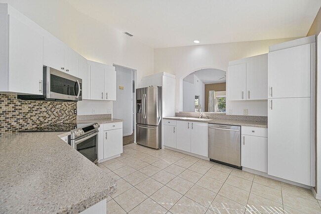 Building Photo - Now Available - 2nd Story Condo with Lake ...