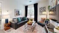 Located at 222 E Boyd Drive in Baton Rouge, Louisiana, this well-appointed 720-square-foot apartment offers 2 bedrooms and 2 bathrooms on a single floor. The open-concept kitchen and living area serves as the heart of the unit, featuring white shaker cabinetry, granite countertops, a breakfast bar with seating, and a full suite of stainless steel appliances including a refrigerator, range, microwave, and dishwasher. In-unit laundry is conveniently tucked nearby. The living room provides a bright, welcoming space with large windows that invite abundant natural light and views of the surrounding greenery. Each bedroom is generously proportioned with large windows, light wood-style flooring, and ample room for a desk and workspace. The primary bedroom measures 120 square feet and is served by a private bathroom with a granite-topped vanity and a dedicated closet. The second bathroom features a full soaking tub and shower combo with a matching granite vanity. Light wood-style flooring flows throughout the unit, complementing the clean white walls and creating a cohesive, modern aesthetic. A dedicated closet adds practical storage to this efficiently designed, move-in-ready Baton Rouge apartment.