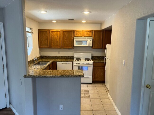 Building Photo - Ground Floor Condo. Granite Kitchen. Upgra...