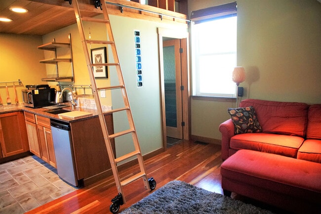 Several windows, glass bottle art installation, bathroom door - 69 S Shannon Ave