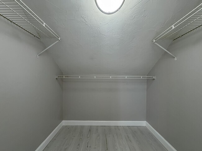 Building Photo - MODERN PARADISE! 2/2 w/ Marble Counters, Stainless Steel Appliances, Vaulted Ceilings, & More! Av...
