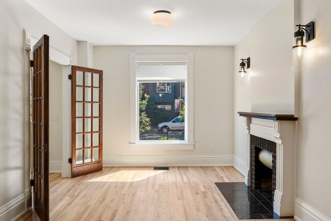 Large, bright living room off of entry. Great view of the front patio! - 3347 Tejon St