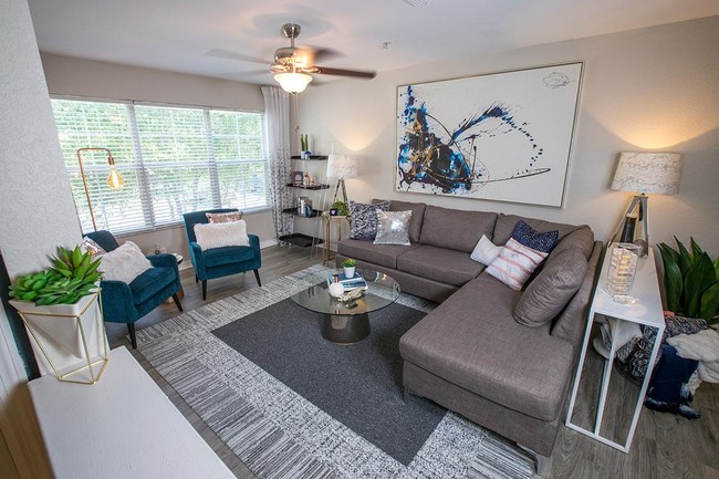 Spacious living rooms featuring large windows and a ceiling fan. - Retreat 138