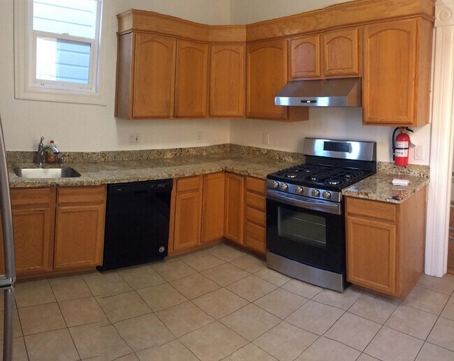 Large kitchen has new appliances, dishwasher, garb disposal, three windows. - 3632 17th St