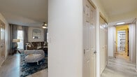 This single-story, 3-bedroom, 2-bathroom home offers a functional and comfortable layout across a well-utilized floor plan. Two hallways connect the living areas to the private quarters, creating a clear separation between communal and bedroom spaces.

The living area features a ceiling fan and connects seamlessly to one of two dining spaces — one of which showcases light wood-style flooring and a decorative chair rail, providing an intimate setting for meals. The galley-style kitchen is equipped with warm wood cabinetry, granite-look countertops, a white subway tile backsplash, stainless steel appliances including a refrigerator and dishwasher, and easy-to-maintain tile-style flooring.

Both bathrooms feature wood-tone vanities with granite-style countertops. One bathroom includes a tub-shower combination. The two closets offer built-in shelving and hanging rods for organized storage.

All three bedrooms are carpeted and include ceiling fans. The spacious primary bedroom features dual windows with draping curtains, providing natural light. The secondary bedrooms are similarly designed with carpet flooring and ceiling fans. A dedicated in-unit laundry area accommodates a full-size washer and dryer with overhead shelving.