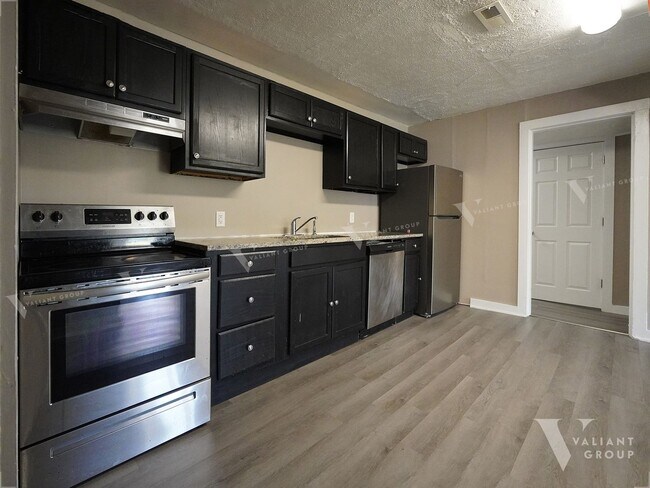 Building Photo - Charming Three-Bedroom, Two-Bathroom Stone...