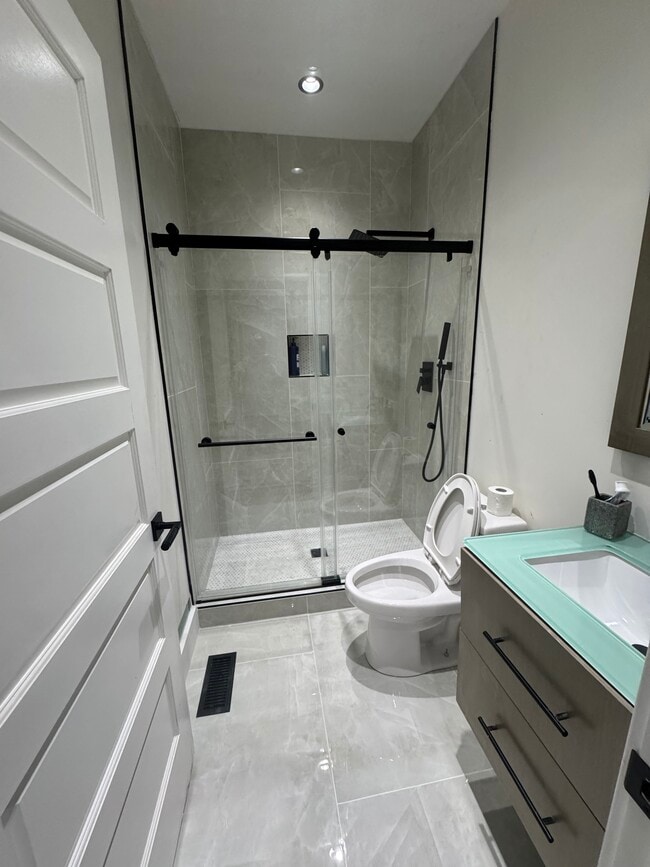 Newly renovated bathroom with oversized shower head - 253 35th Ave N