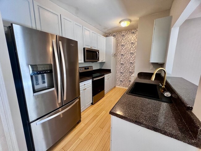 Building Photo - Beautifully Remodeled Corner Condo with Dual Primary Suites in The Villas at Bellamy