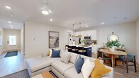 This meticulously designed 1870 square foot home in McDonough, GA, offers a harmonious blend of comfort and functionality across two floors. The ground floor, spanning 970 square feet, houses an open-concept living area that seamlessly integrates the kitchen, dining room, and living room. The kitchen boasts modern appliances, white cabinetry, and a central island with pendant lighting, ideal for casual dining or food preparation.

The upper floor, covering 900 square feet, includes three bedrooms, with the primary suite measuring an impressive 340 square feet. The home features five bathrooms in total, ensuring convenience for residents and guests alike. Additional spaces include a dedicated office, laundry room, and multiple closets for ample storage.

Throughout the home, light wood flooring and neutral-toned walls create a bright, airy atmosphere. Large windows with plantation shutters allow natural light to flood the rooms, while also offering privacy when needed. The house is adorned with contemporary artwork and stylish furnishings, reflecting a modern aesthetic.

Thoughtful details such as recessed lighting, sleek fixtures, and carefully chosen décor pieces contribute to the overall sophisticated ambiance. The property at 100 Rosemoor Drive combines practical living spaces with elegant design elements, resulting in a inviting and comfortable home environment.