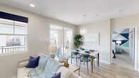 Located at 700 Forest Park Boulevard in Oxnard, CA, this thoughtfully designed 2-bedroom, 2-bathroom residence offers a comfortable and modern living experience across a single floor. Light wood-style flooring flows throughout the open-plan living, dining, and kitchen areas, creating a cohesive and inviting atmosphere. The living room features a corner fireplace with a soft sage accent wall, adding warmth and character to the space. The adjacent dining area is bathed in natural light from sliding glass doors that open onto a private balcony, enhancing the sense of openness. The kitchen is outfitted with dark wood cabinetry, stainless steel appliances, marble-style quartz countertops, and under-cabinet lighting, offering both style and functionality. Each bedroom provides a comfortable retreat, with plush carpeting and distinctive accent walls — one featuring a bold geometric pattern in navy, grey, and teal, and the other a terrazzo-inspired design — complemented by double closets in the second bedroom. Both bathrooms are finished with warm wood vanities, tub-shower combinations, and wood-look flooring, maintaining a clean and consistent aesthetic throughout this well-designed Oxnard residence.
