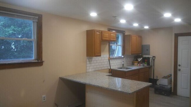 Building Photo - Granite kitchen. All new bath and kitchen....