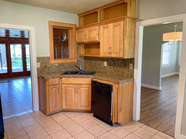 Updated kitchen with views to the den - 175 Manor Street