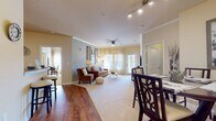 This well-designed apartment offers a harmonious blend of comfort and functionality across its 1010 square feet. The heart of the home is the open-concept living area, seamlessly connecting the kitchen, dining, and living spaces. The kitchen boasts rich wood cabinetry, black appliances, and a convenient breakfast bar, perfect for casual dining or entertaining.

The primary bedroom, spanning 180 square feet, features large windows that flood the space with natural light. Soft, neutral tones create a serene atmosphere, complemented by ample closet space and an en-suite bathroom. The second bedroom offers versatility as a guest room or home office.

Both bathrooms are modern and well-appointed, with one featuring a shower/tub combination. The in-unit laundry room adds convenience to daily living. Throughout the apartment, you'll find a mix of warm wood flooring and plush carpeting, creating a cozy yet sophisticated ambiance.

The living room showcases a stylish blend of contemporary and rustic elements, with barn-style sliding doors as a focal point. Thoughtful touches like crown molding and ceiling fans enhance the overall aesthetic. With its well-planned layout and attention to detail, this apartment offers a comfortable and inviting living space in the desirable Ooltewah area.