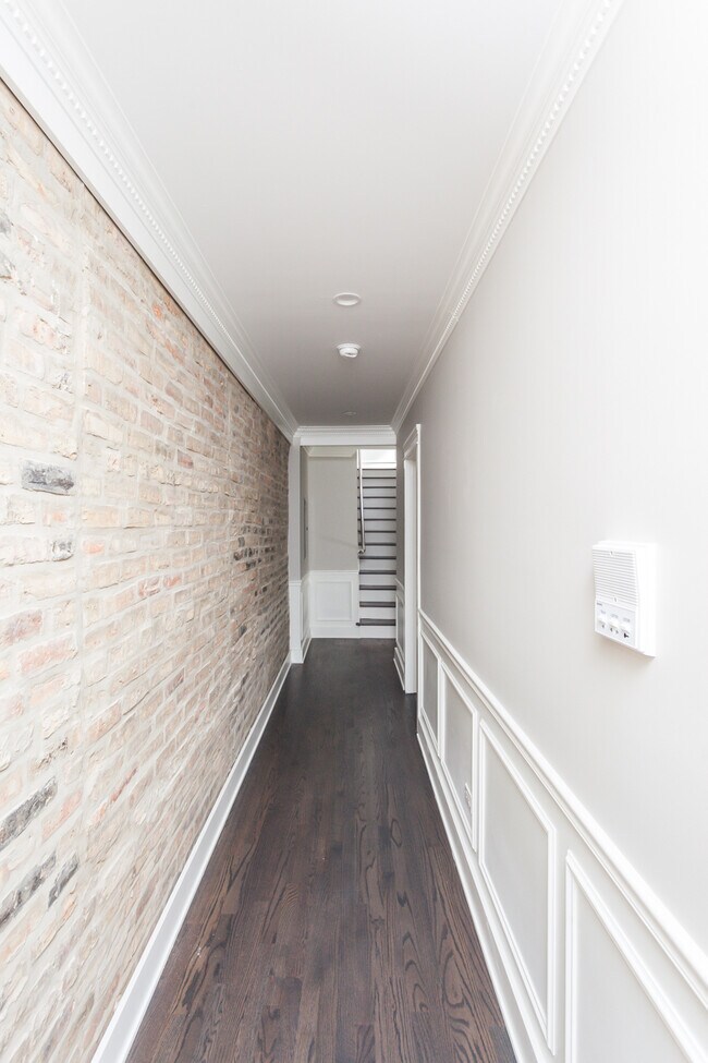 Hallway with Exposed Brick - 3056 W Palmer Blvd