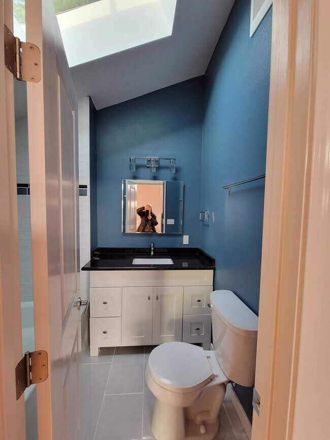 Full bathroom with tiled tub and shower - 336 N 73rd St