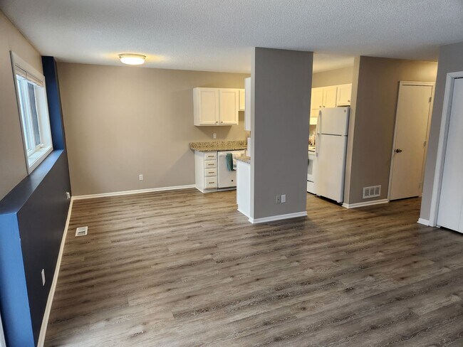 Living room and dining room looking towards kitchen - 1351 Idaho Ave S