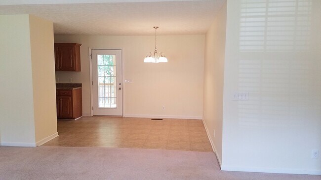 Building Photo - Charming Home with Covered Back Deck and Fenced in Yard...