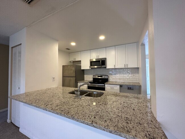 Newly renovated kitchen with new appliances! - 9940 7th Way N