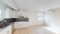 This 610 square foot single-story residence in Winnetka, California, offers a modern and efficient living space. The home features two bedrooms, including a primary bedroom of 160 square feet, and one bathroom. Throughout the property, light hardwood flooring creates a cohesive and contemporary aesthetic.

The interior is characterized by crisp white walls and recessed lighting, enhancing the sense of spaciousness. Large windows in the bedrooms and living areas allow for ample natural light, creating a bright and airy atmosphere. The bathroom showcases a modern design with a glass-enclosed shower, marble-like tiling, and a wooden vanity, blending functionality with style.

The property includes a dedicated laundry area with stacked washer and dryer units, maximizing space efficiency. Climate control is provided by a wall-mounted air conditioning unit, ensuring comfort throughout the year. The kitchen area, while compact, features white cabinetry and a countertop, maintaining the home's clean and contemporary look.

Despite its modest size, the layout appears well-thought-out, with a hallway connecting the various rooms and providing a sense of separation between living spaces. The overall design emphasizes minimalism and functionality, making efficient use of the available square footage while creating a modern and inviting home environment.