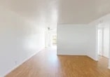 Located at 4415 N Pershing Ave in Stockton, California, this single-story 2-bedroom, 1-bathroom home offers a clean and functional layout throughout. The living room is bright and open, featuring warm wood-look laminate flooring, white walls, and a ceiling fan that adds to the airy feel of the space. A large front window allows natural light to pour in, creating a welcoming atmosphere.

The kitchen flows directly from the living area and is well-equipped with warm-toned cabinetry, a white tile backsplash, ample upper and lower storage, a double basin sink, and white appliances including an electric range, microwave, and refrigerator. A sliding glass door in the kitchen area opens to the outdoors, providing convenient outdoor access and additional natural light.

Both bedrooms feature plush carpeting, crisp white walls, and windows that invite natural light. The primary bedroom offers a comfortable amount of space, while a hallway closet provides additional storage for the home.

The bathroom is well-appointed with a white vanity, tile countertop, and a shower-tub combination enclosed by sliding glass doors, complemented by a window above for ventilation. Wood-look flooring carries through the bathroom, maintaining a cohesive aesthetic throughout the home.