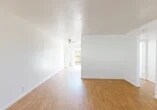 Located at 4415 N Pershing Ave in Stockton, California, this single-story 2-bedroom, 1-bathroom home offers a clean and functional layout throughout. The living room is bright and open, featuring warm wood-look laminate flooring, white walls, and a ceiling fan that adds to the airy feel of the space. A large front window allows natural light to pour in, creating a welcoming atmosphere.

The kitchen flows directly from the living area and is well-equipped with warm-toned cabinetry, a white tile backsplash, ample upper and lower storage, a double basin sink, and white appliances including an electric range, microwave, and refrigerator. A sliding glass door in the kitchen area opens to the outdoors, providing convenient outdoor access and additional natural light.

Both bedrooms feature plush carpeting, crisp white walls, and windows that invite natural light. The primary bedroom offers a comfortable amount of space, while a hallway closet provides additional storage for the home.

The bathroom is well-appointed with a white vanity, tile countertop, and a shower-tub combination enclosed by sliding glass doors, complemented by a window above for ventilation. Wood-look flooring carries through the bathroom, maintaining a cohesive aesthetic throughout the home.