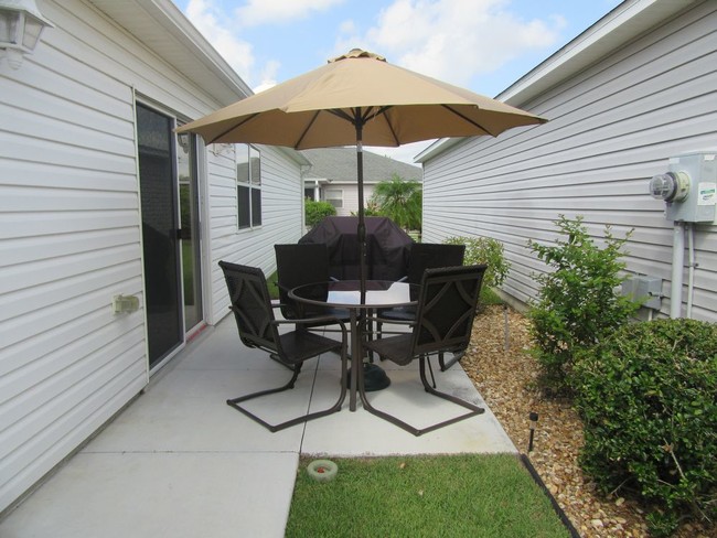 Building Photo - Updated Patio Villa with a Golf Cart