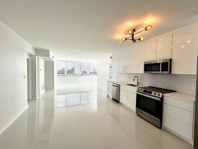 Photo - Fully Renovated East-Facing 2BR/2BA + Bonus Room | Ocean Views | In-Unit W/D Apartment