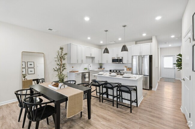 B1 - 2 habitaciones, 2 baños - 1174 pies cuadrados - Comedor - Arbor View Townhomes