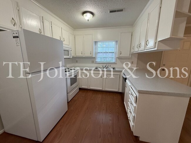 Building Photo - Charming 2-Bedroom with Fireplace & Modern...